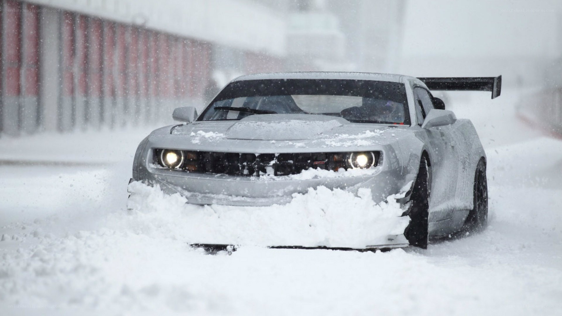 car driving in heavy snow