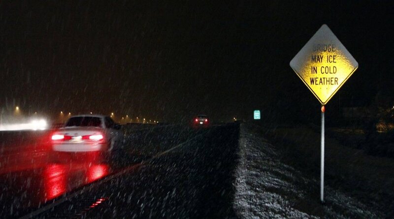 Car driving in snowy night