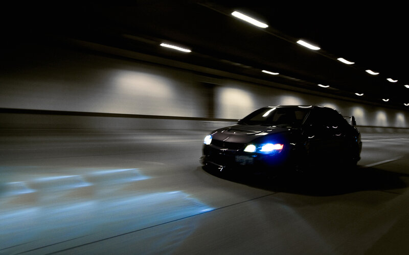 car driving in tunnel at night