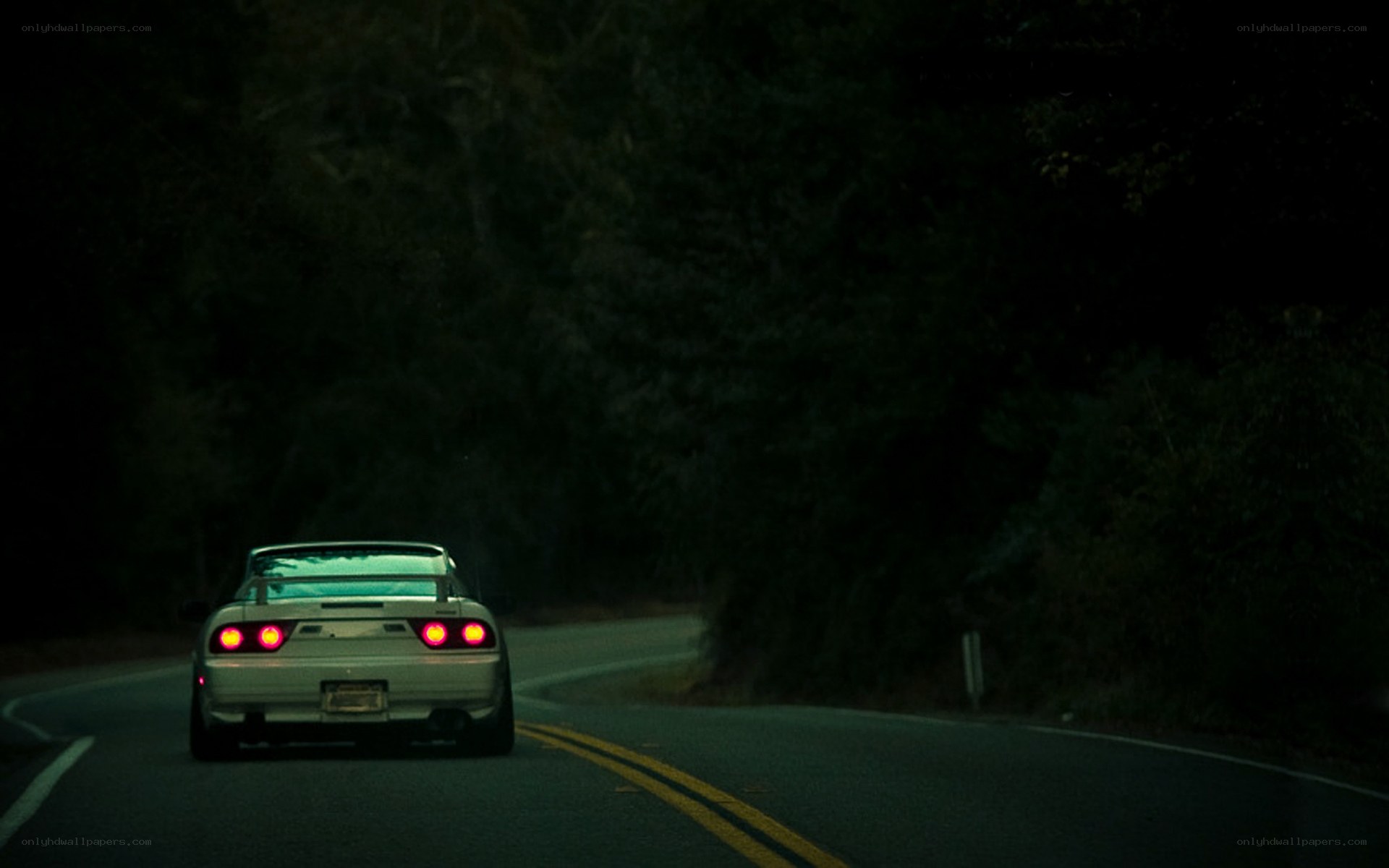 car driving on dark road