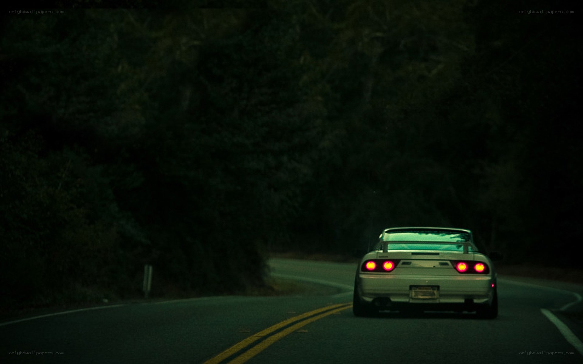 car driving on dark road