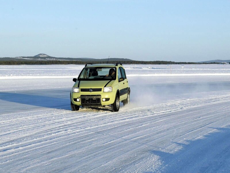 Car driving on frozen lake