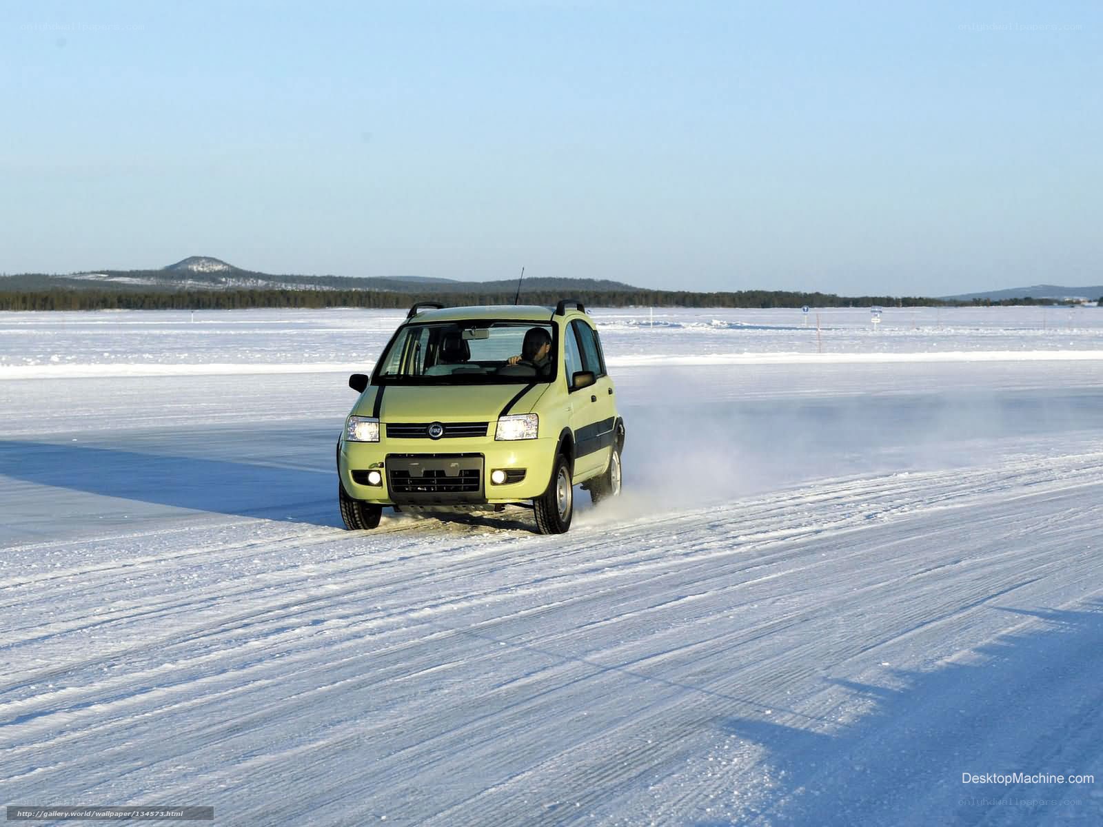 Car driving on frozen lake