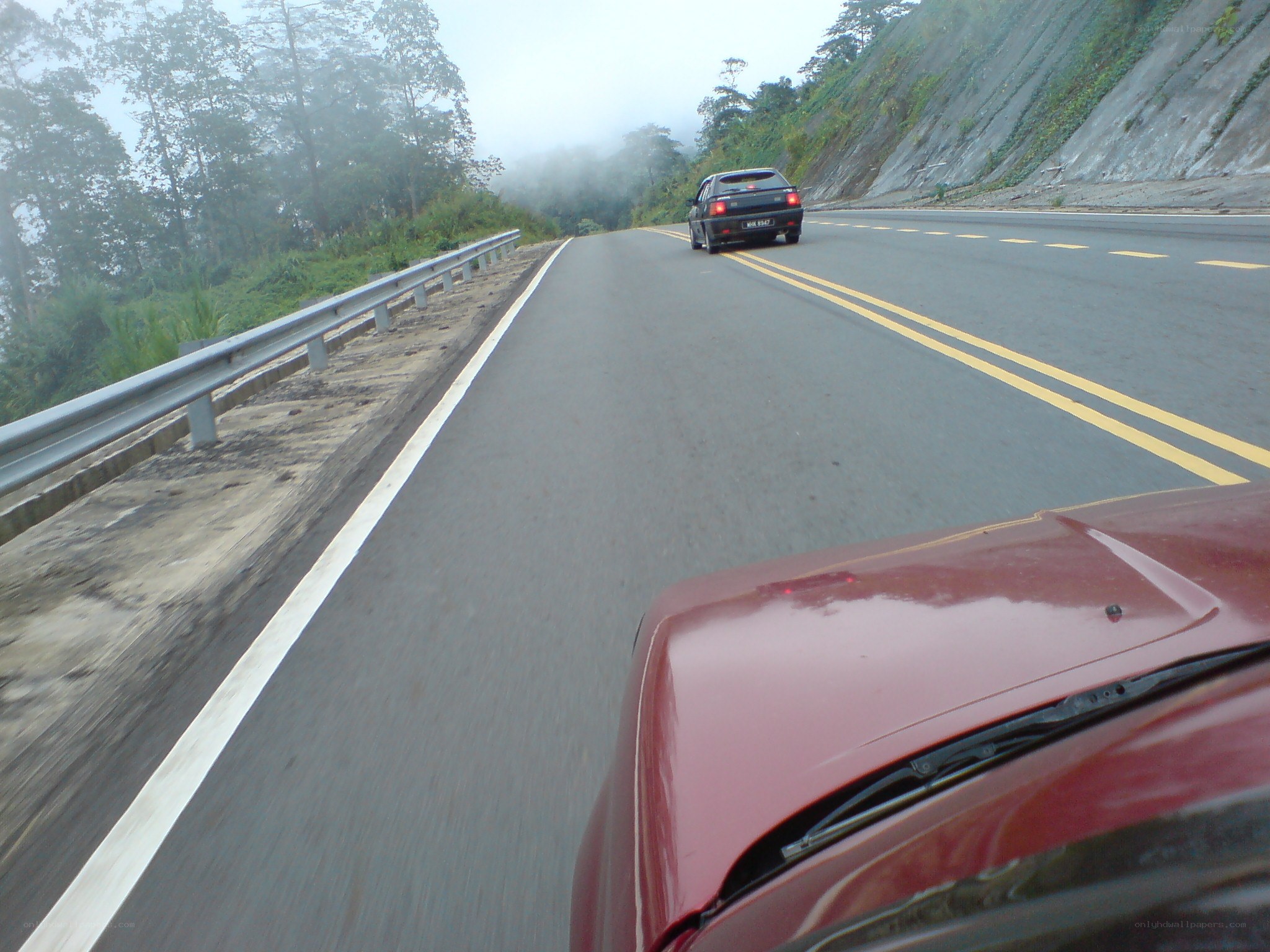 car driving on mountain road