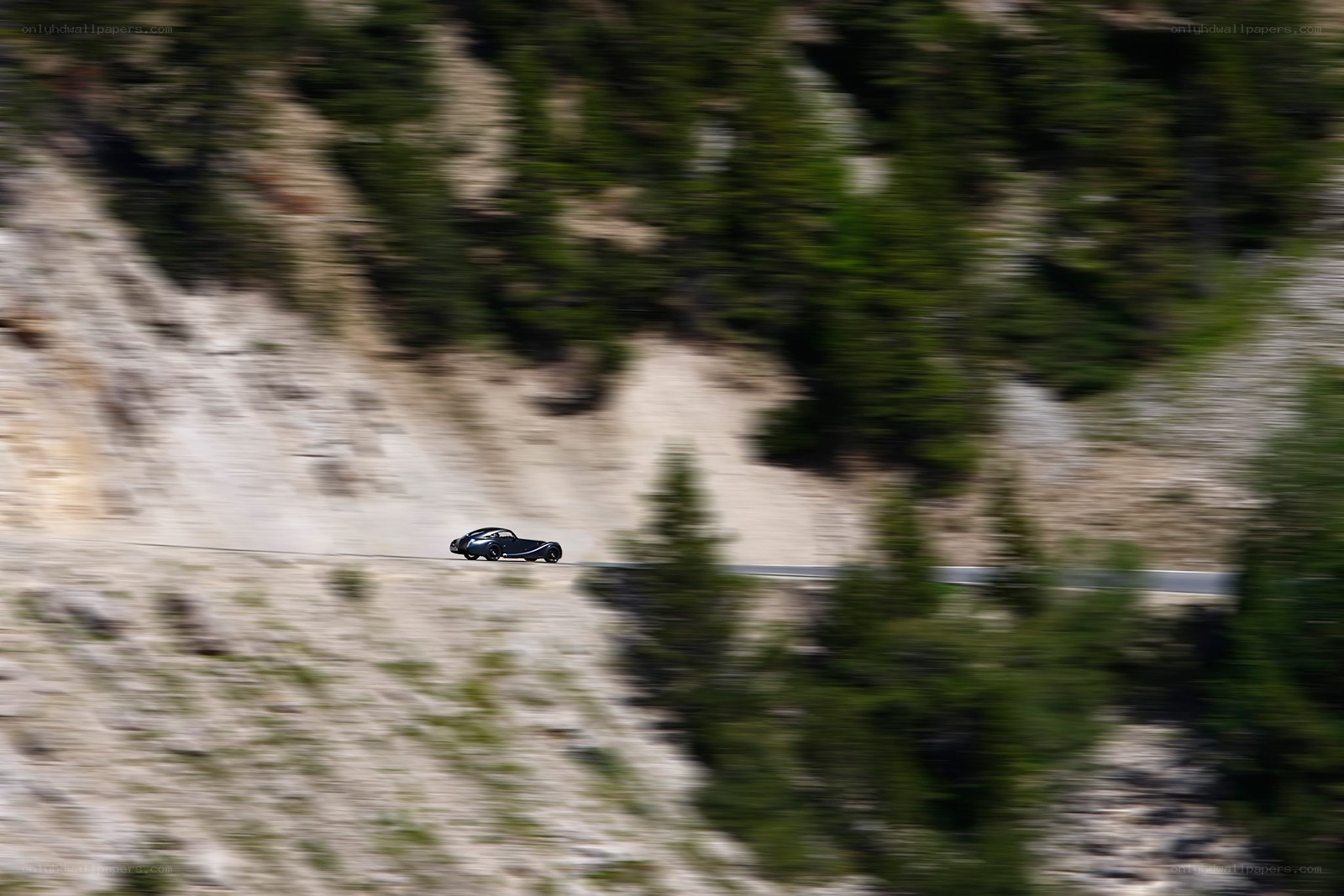 car driving on mountain road