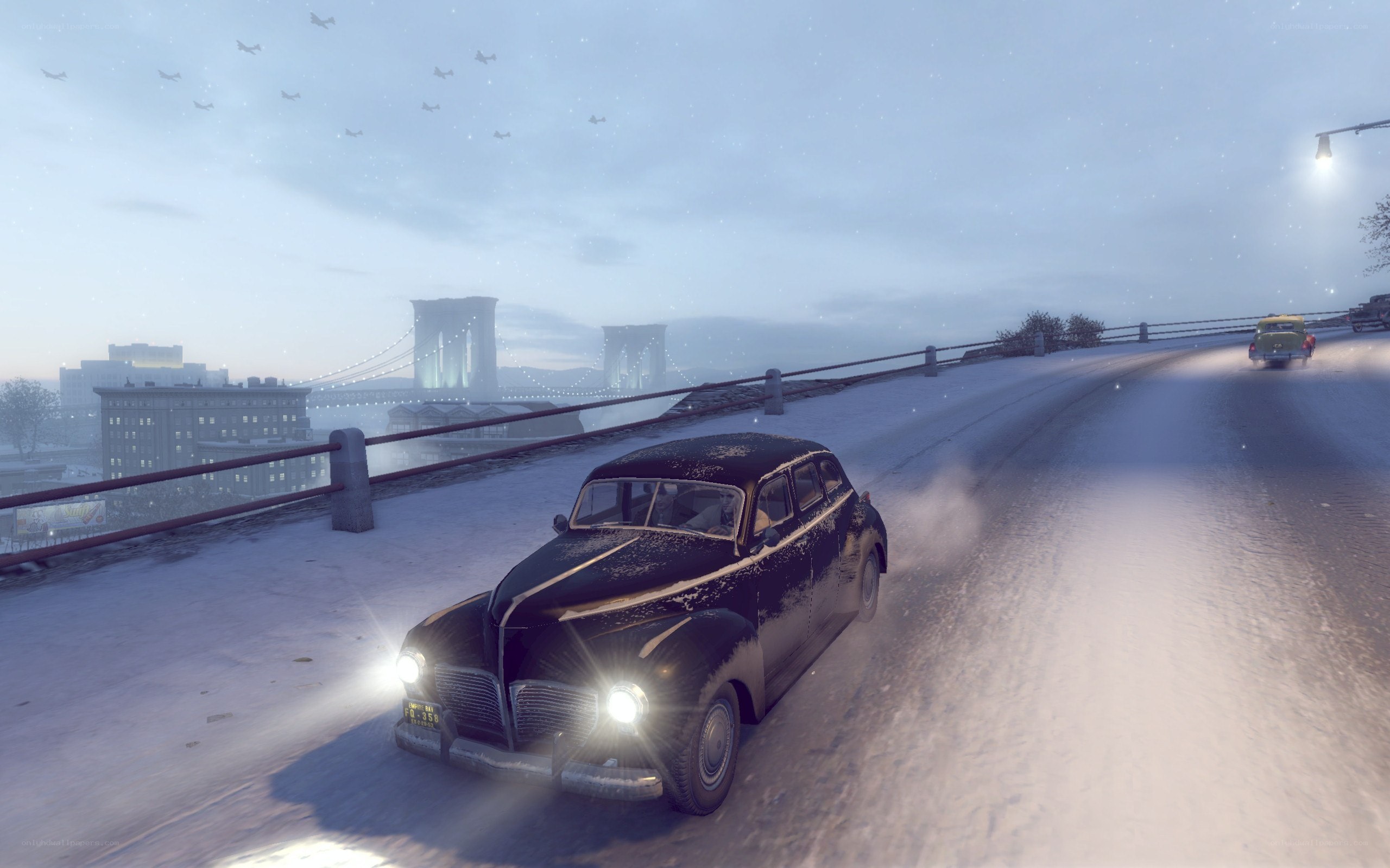 Car driving on snowy bridge