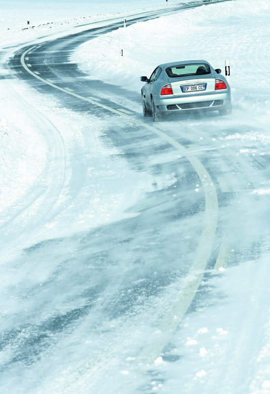 Car driving on snowy road