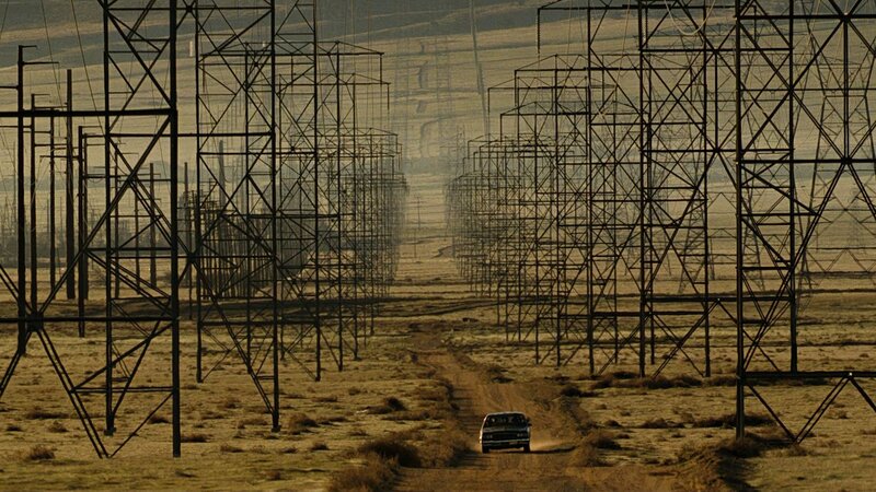 Car driving through power lines