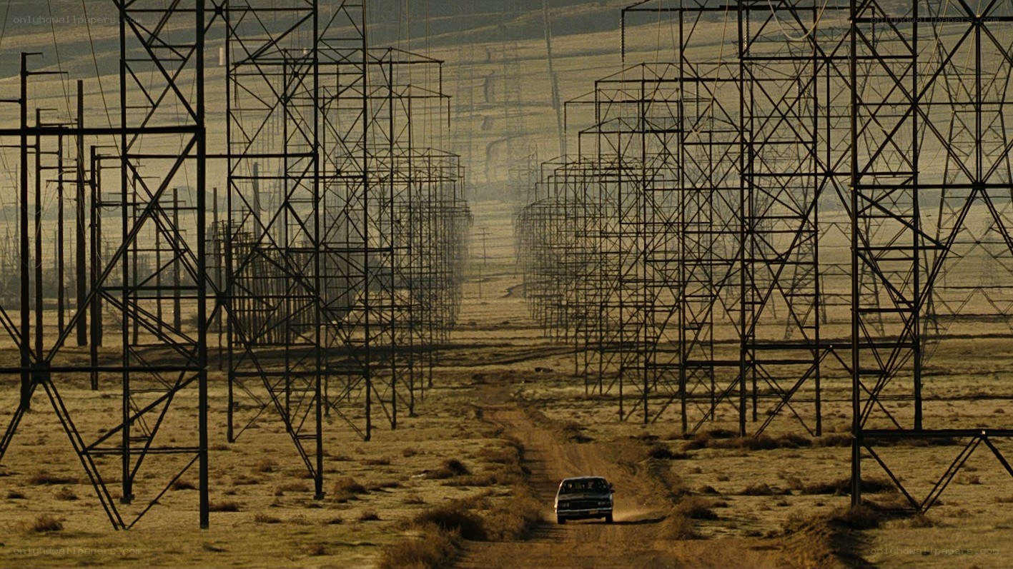 Car driving through power lines