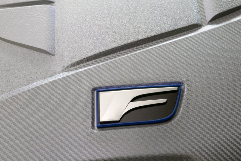 car emblem on carbon fiber