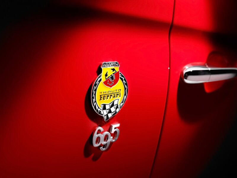 Car Emblem on Red Door