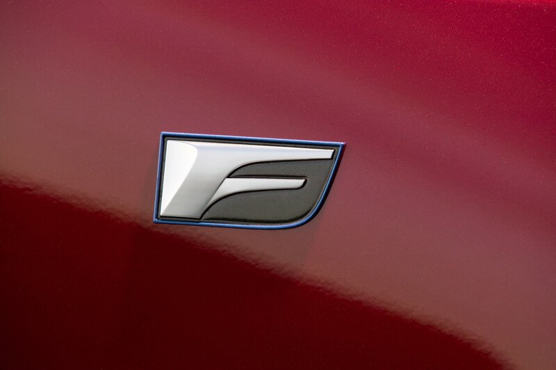 car emblem on red surface