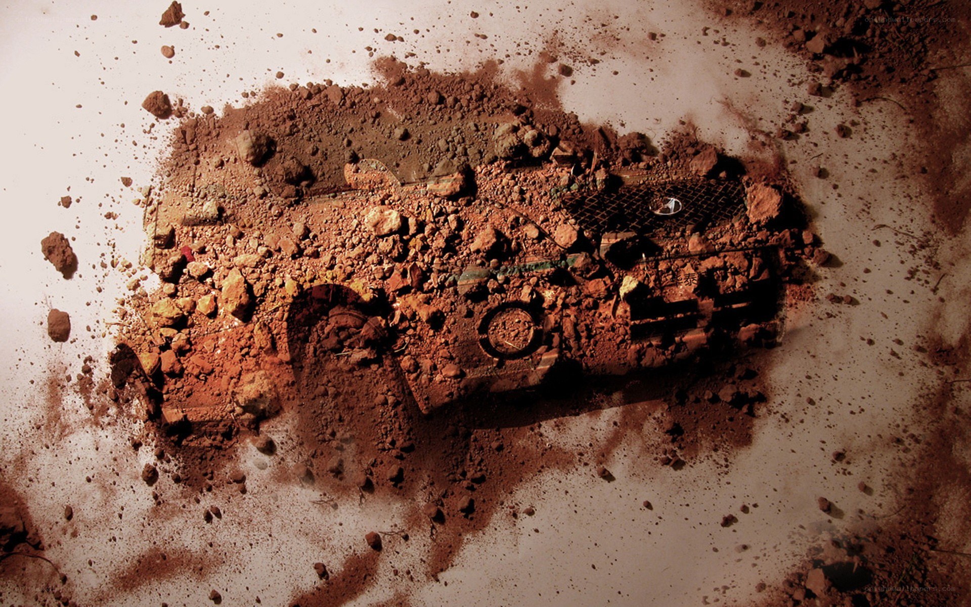 car emerging from dirt