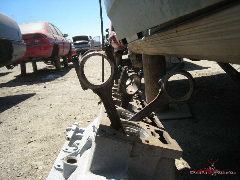Car engine parts in junkyard