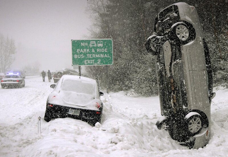 Car flipped in snowstorm