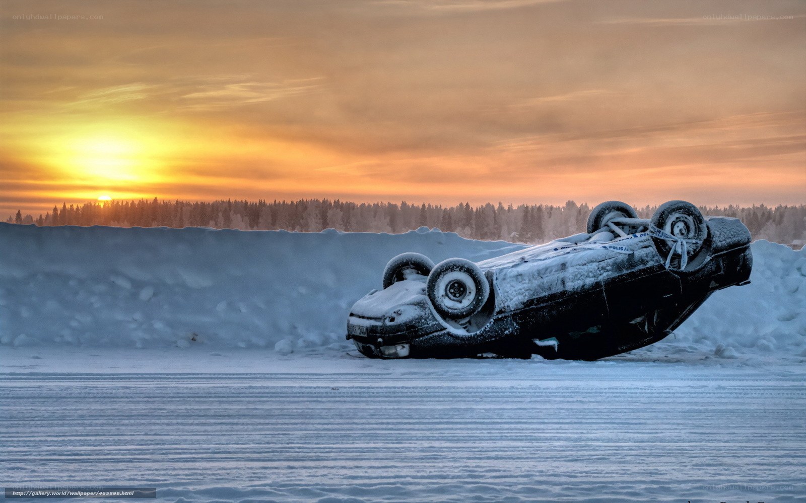 Car flipped on icy road