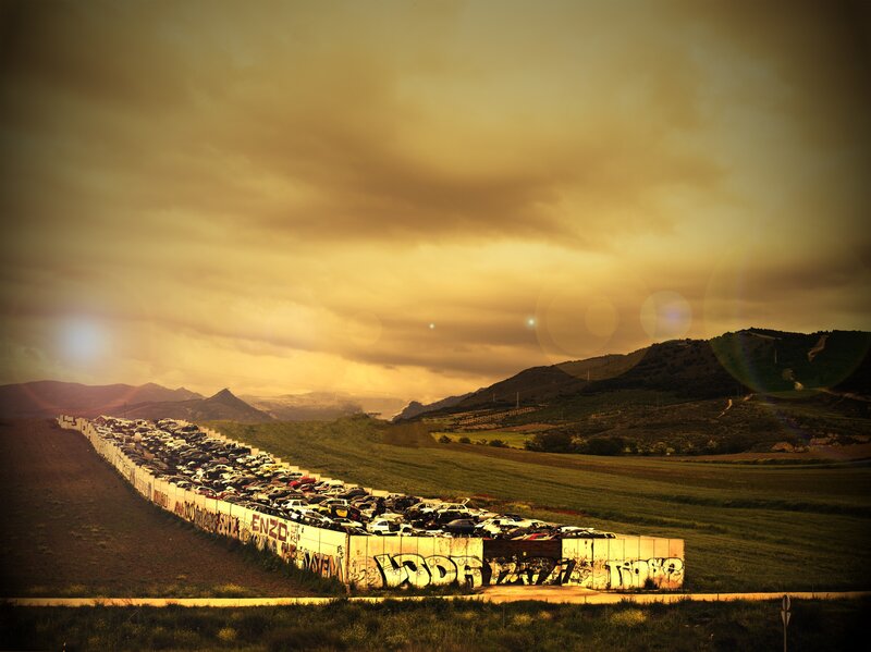 Car graveyard at sunset