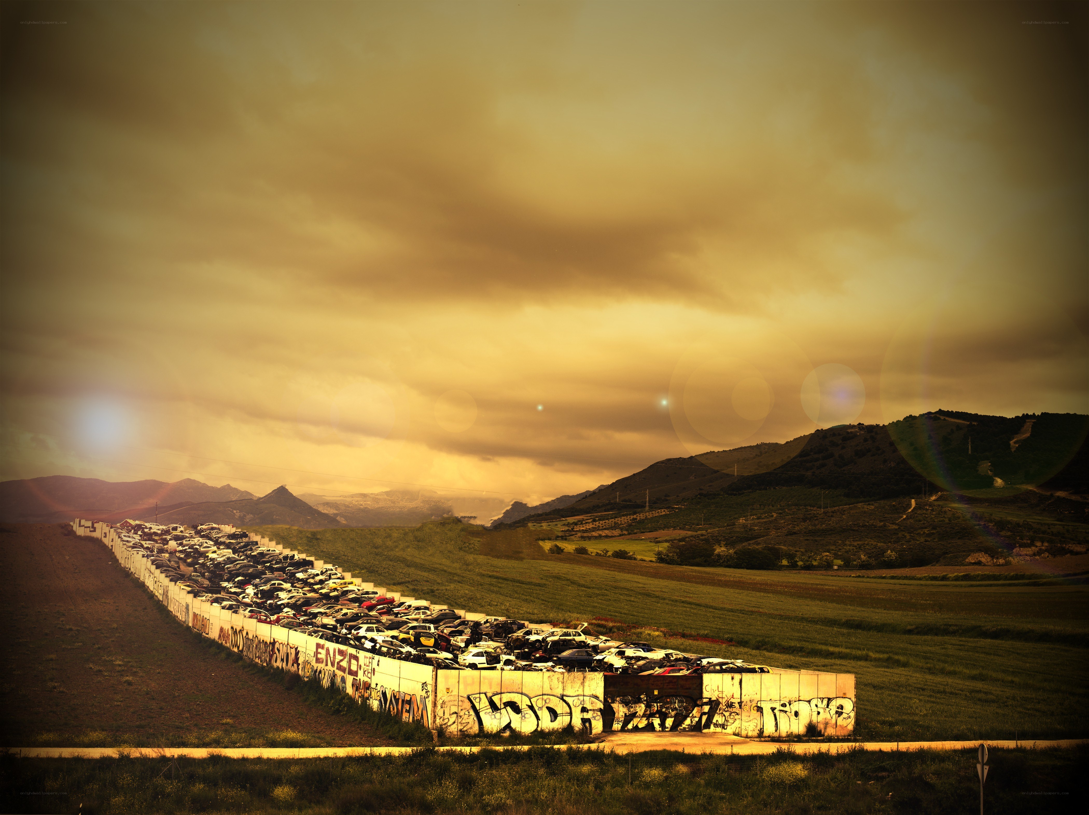 Car graveyard at sunset