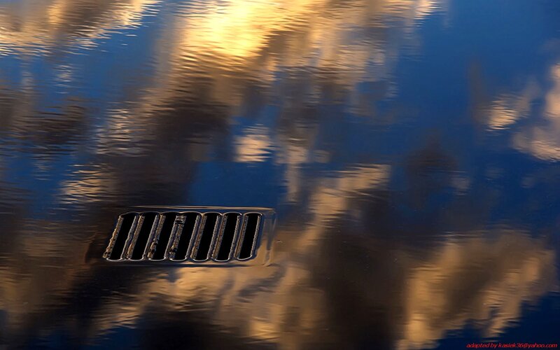 Car Grille in Water Reflection