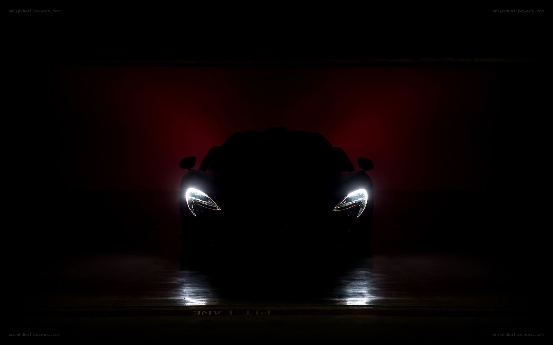 car headlights in dark garage