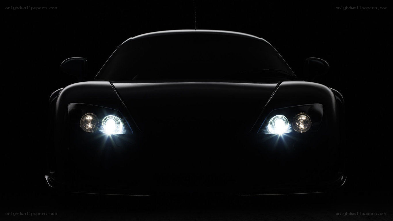 car headlights in darkness