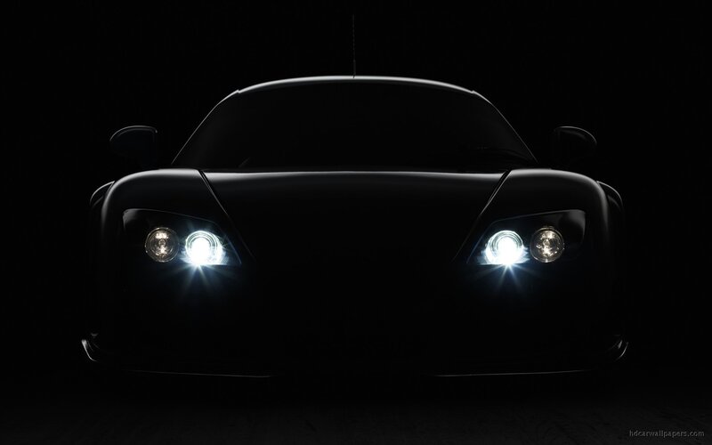 car headlights in darkness