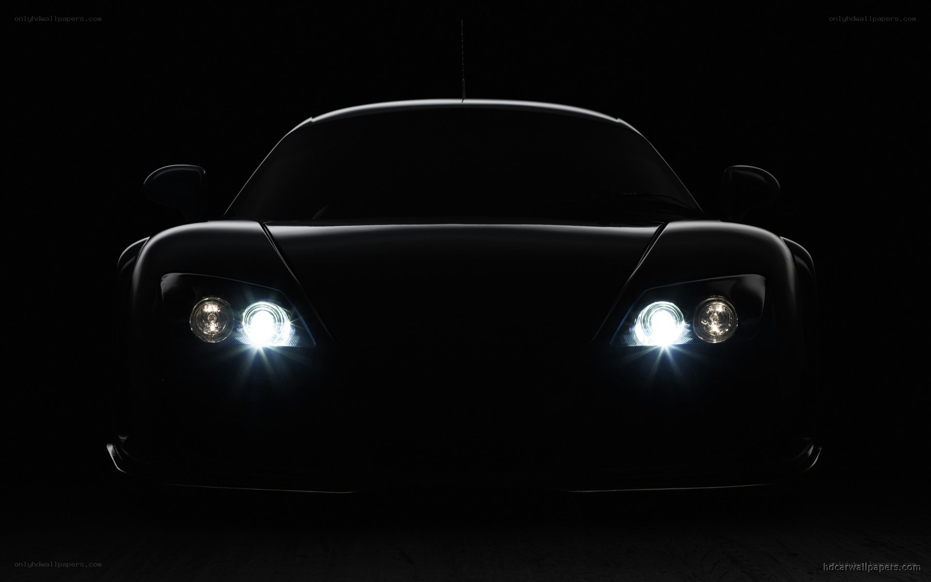 car headlights in darkness