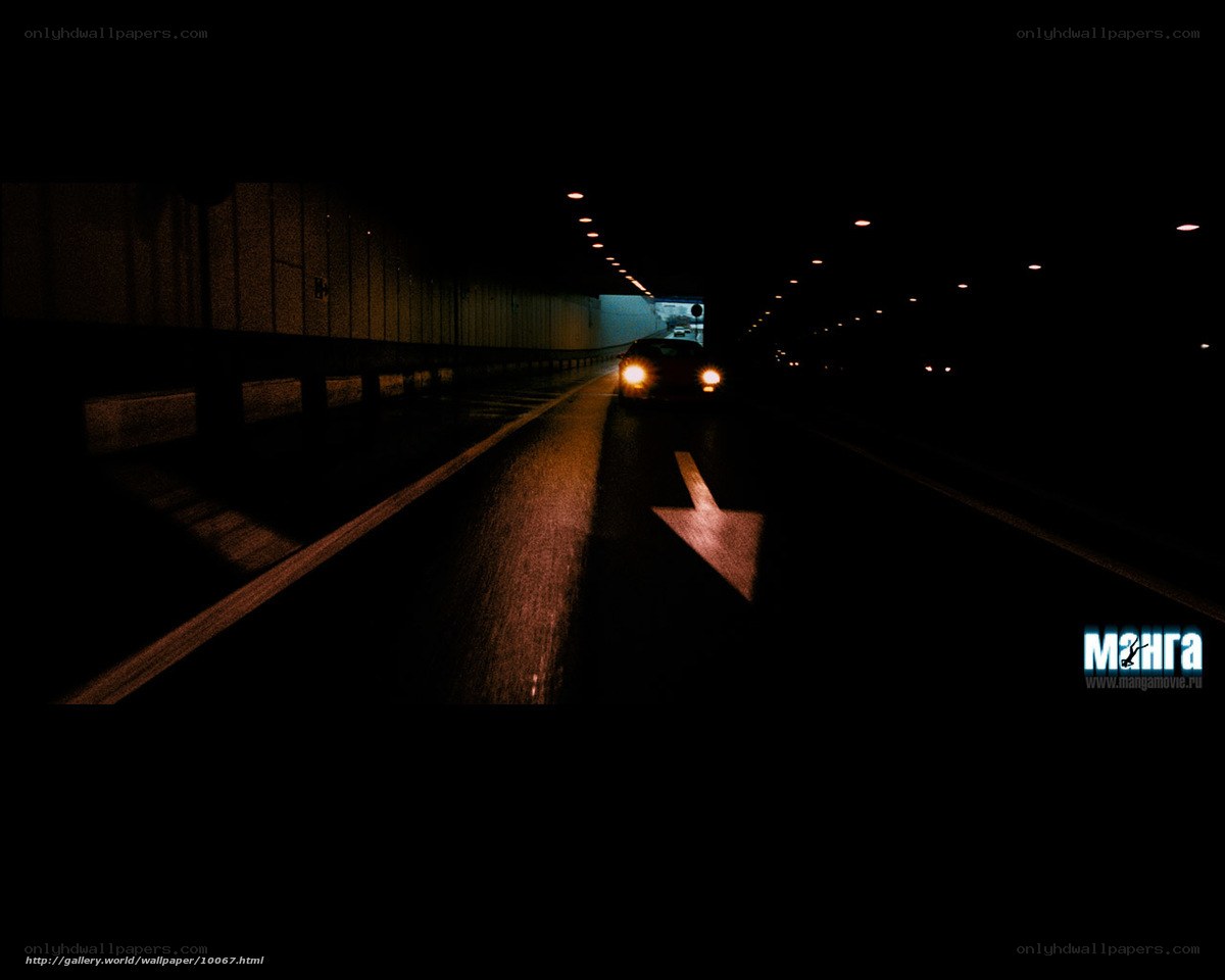Car in a dark tunnel