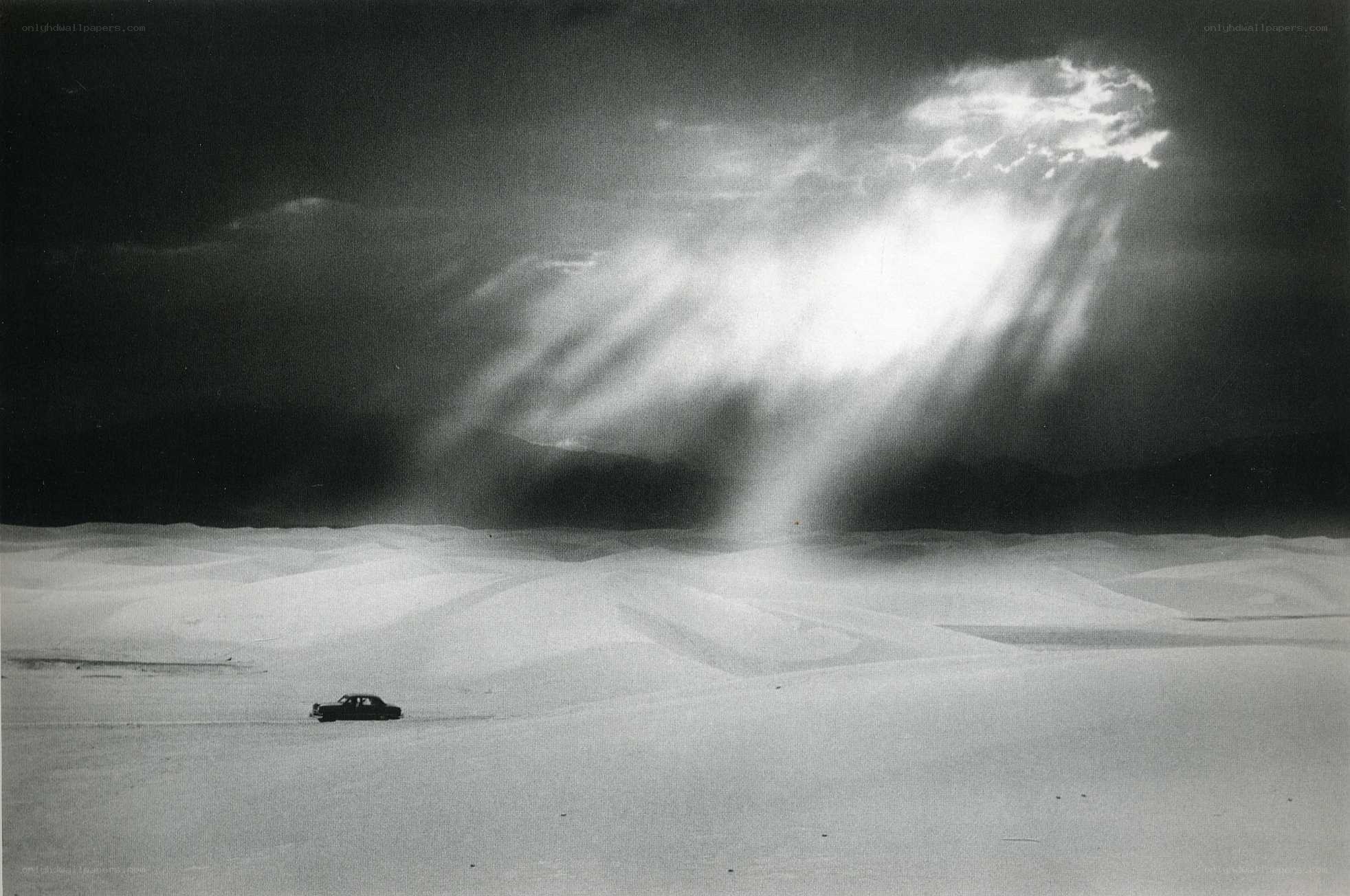 Car in a desert storm