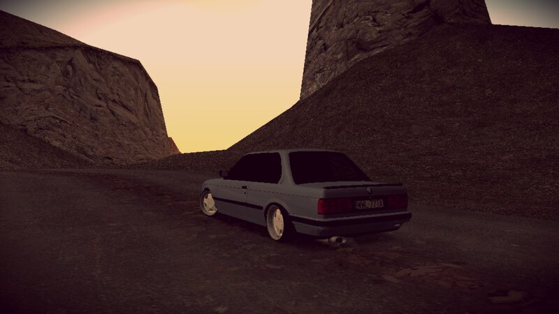 car in canyon at sunset