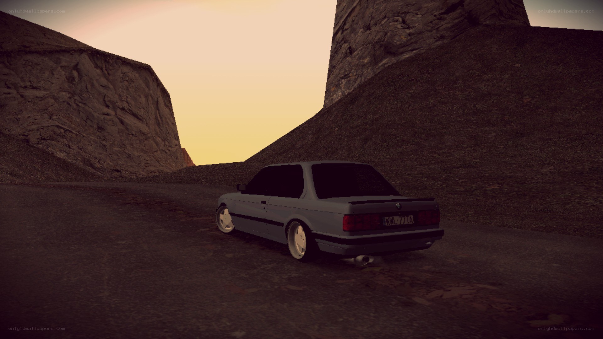 car in canyon at sunset