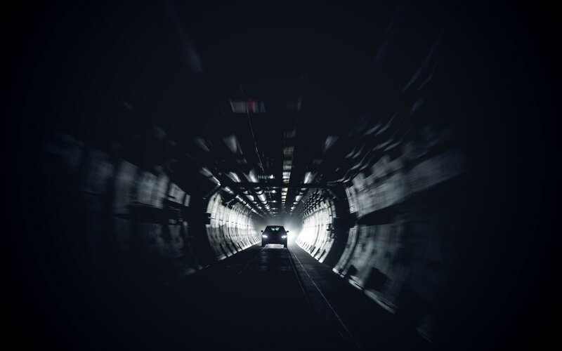 Car in Dark Tunnel