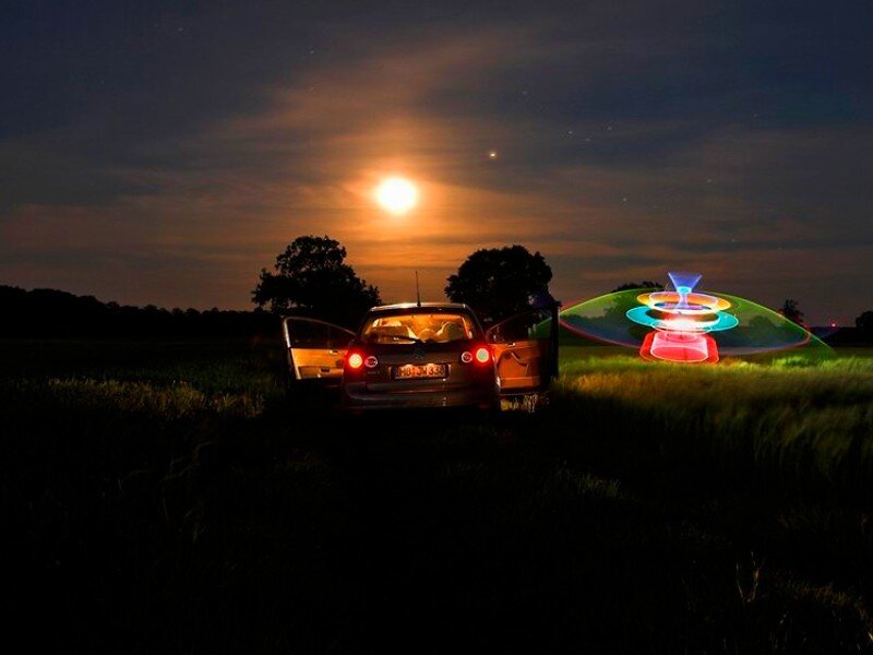 Car in field with light painting