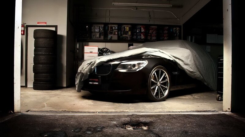 car in garage with cover