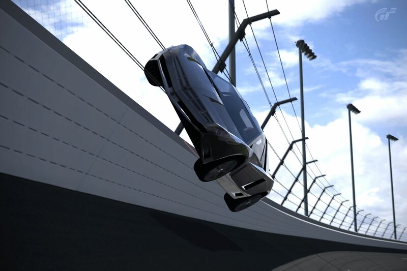 Car in mid-air on a racetrack