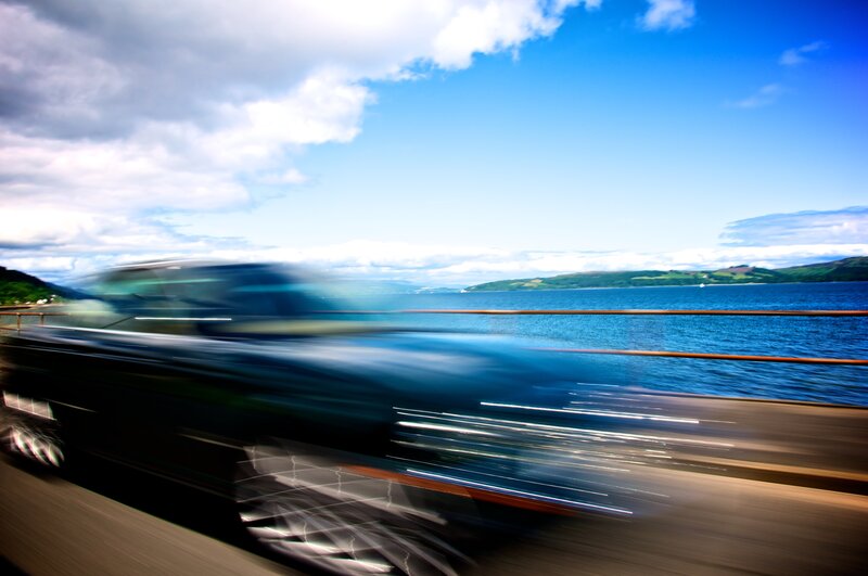 Car in Motion on Bridge
