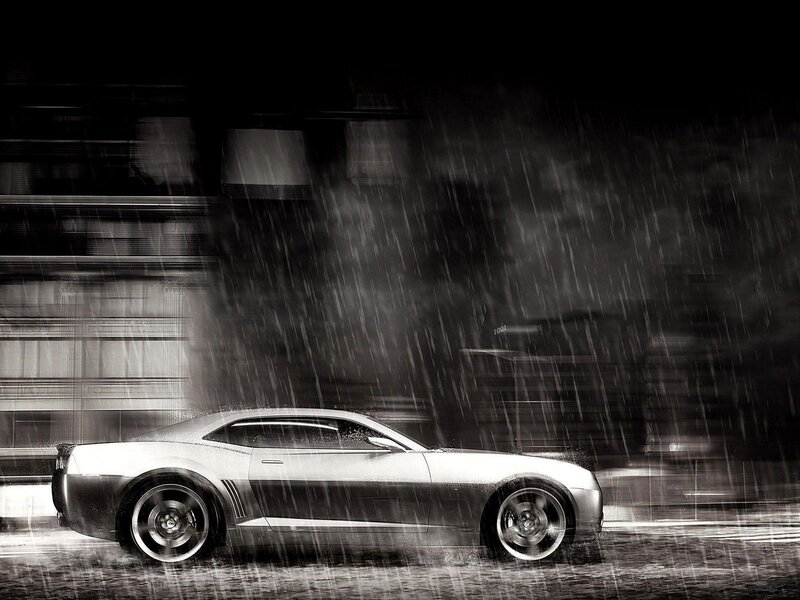 Car in rain at night