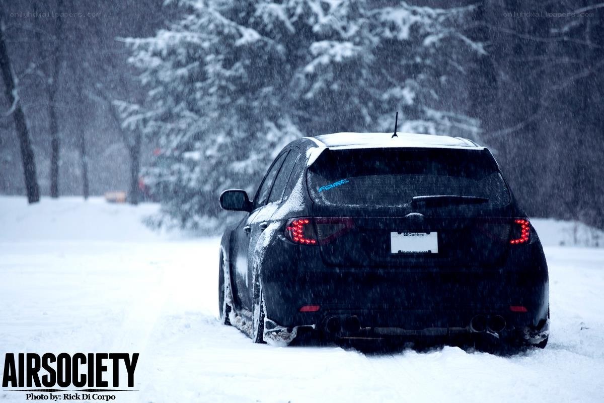 Car in snowy forest