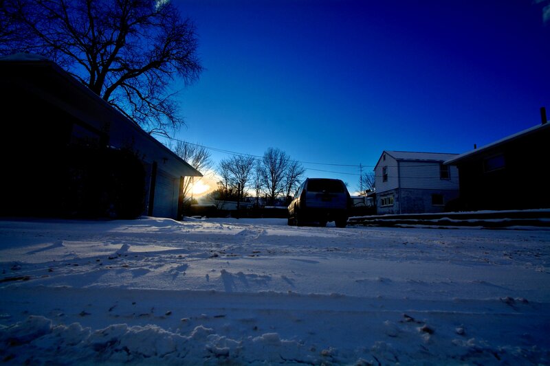 Car in Snowy Yard