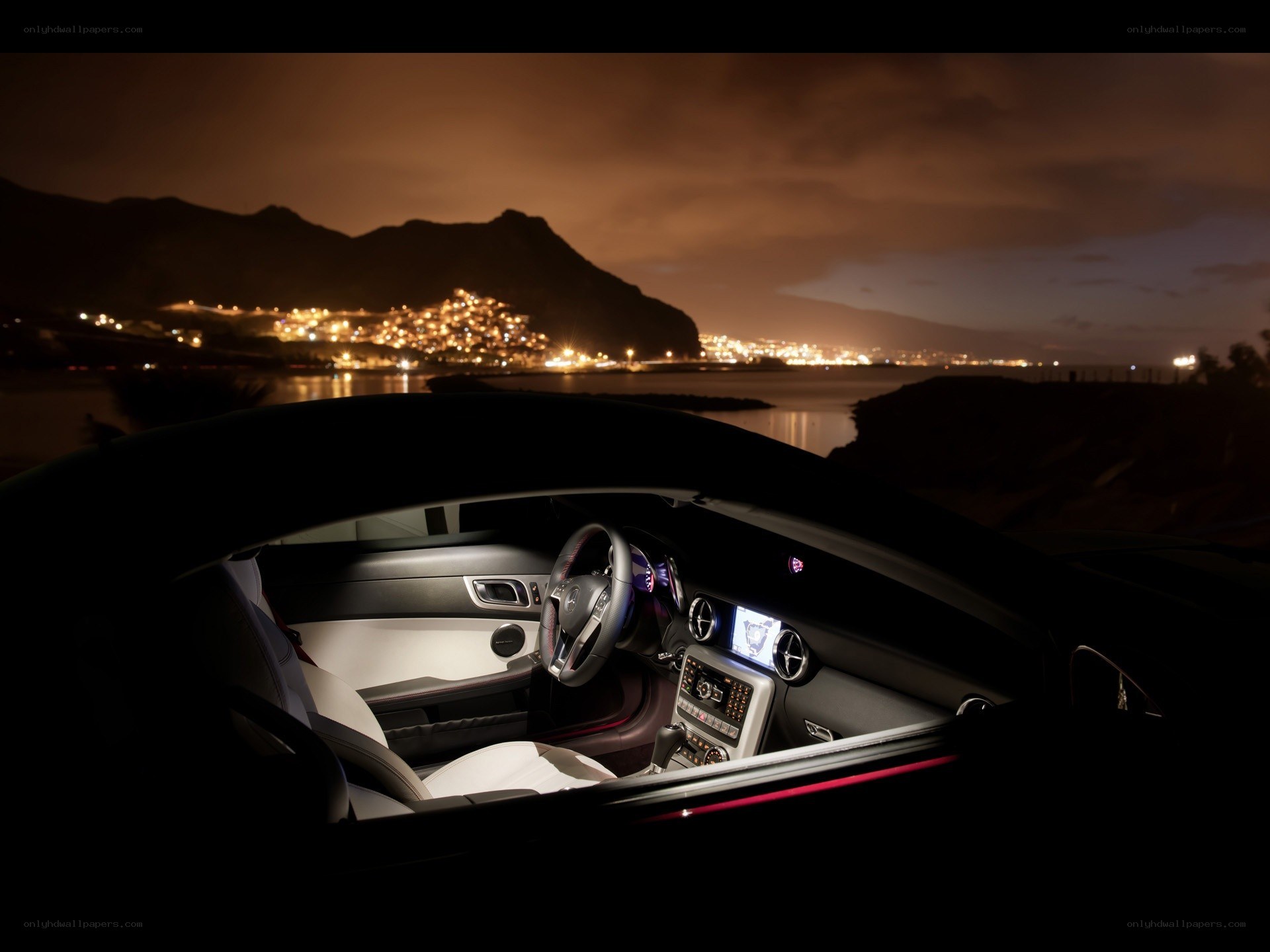 Car interior at night with city view