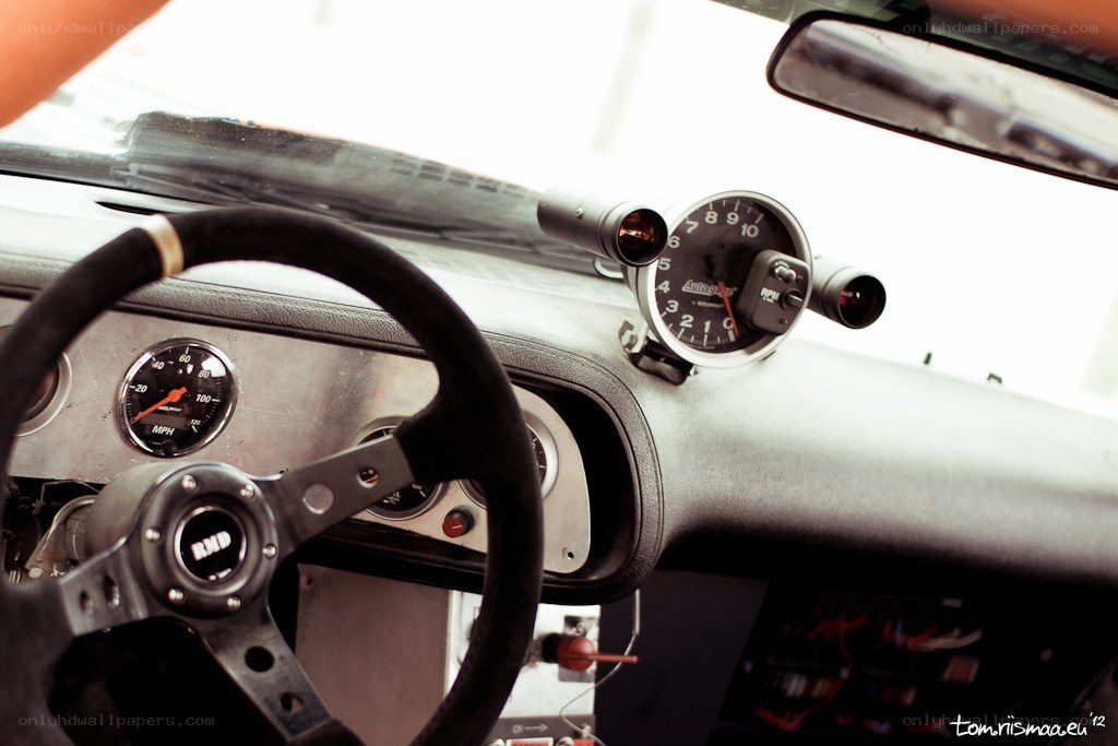 car interior with racing steering wheel