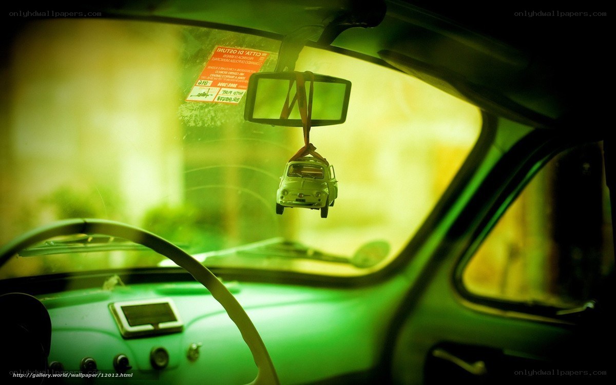 car interior with toy car hanging