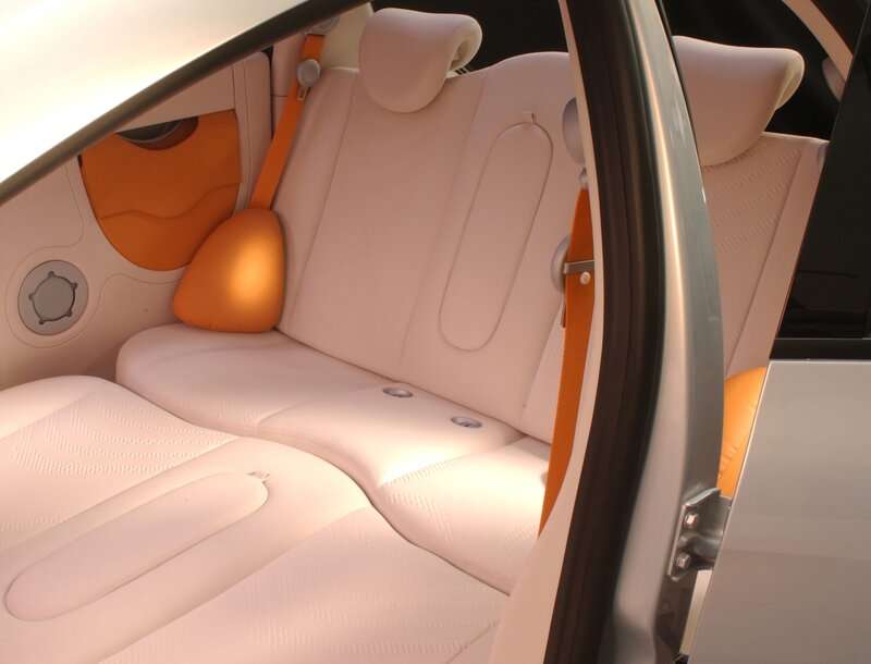 Car interior with white and orange seats