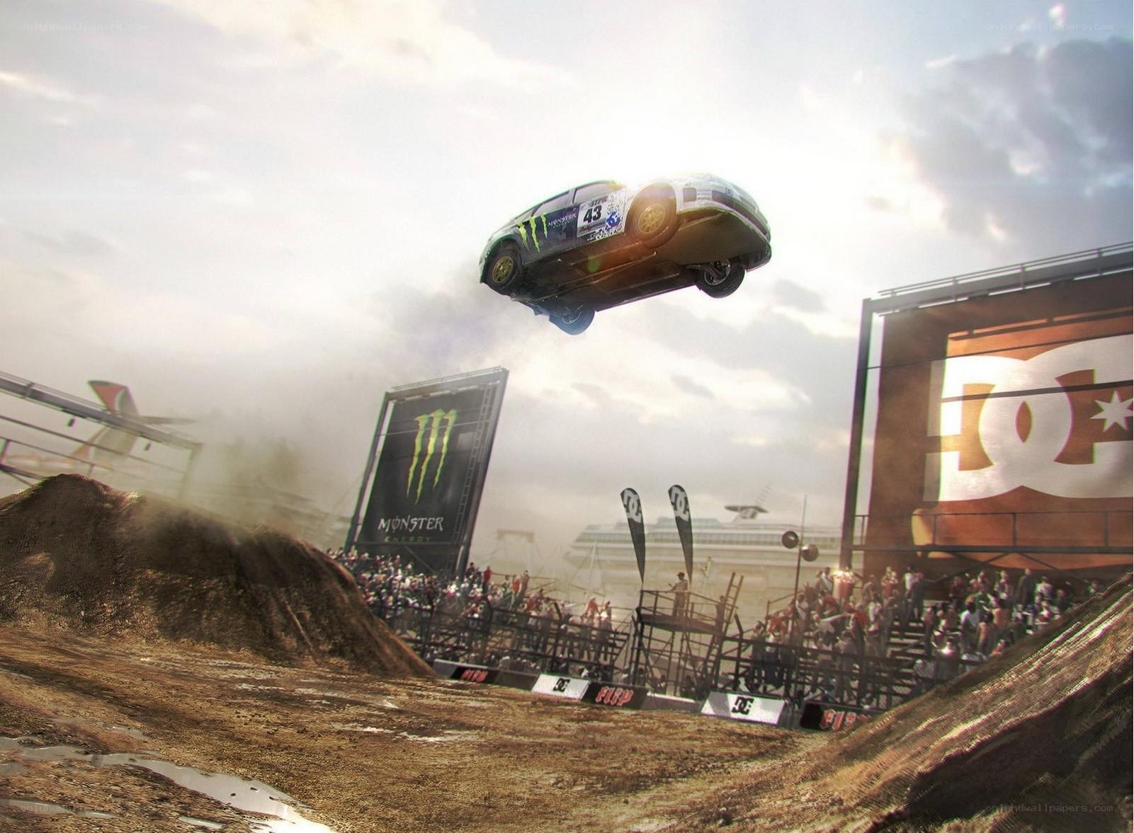 Car jumping over dirt ramp