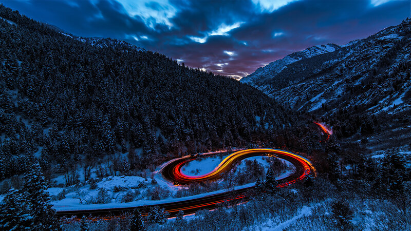 Car Light Trails on Mountain Road — Blue