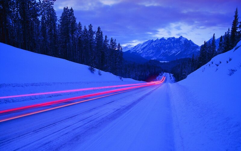 Car Lights on Snowy Road — Blue, Serene, Night