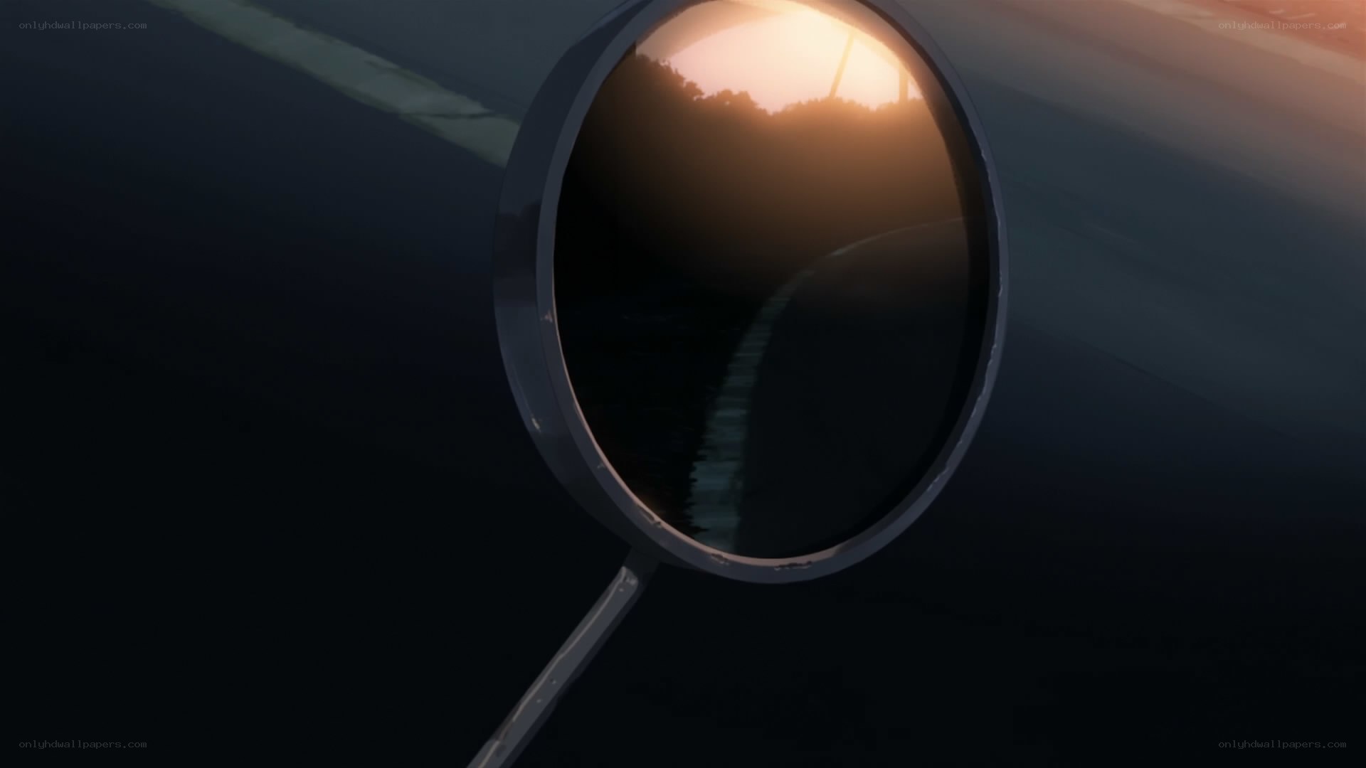car mirror reflecting sunset