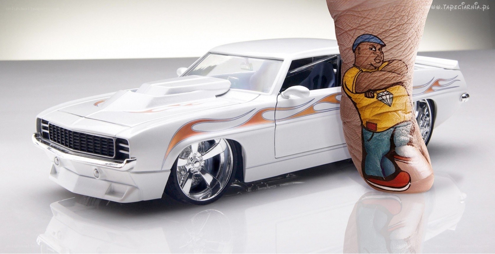 car model with tattooed foot
