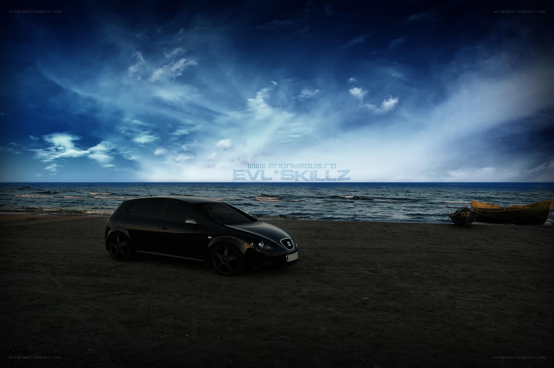 Car on a beach at night