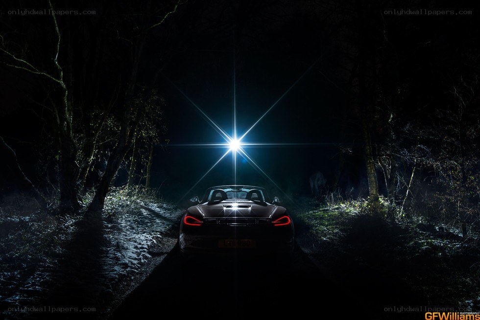 Car on a dark forest road